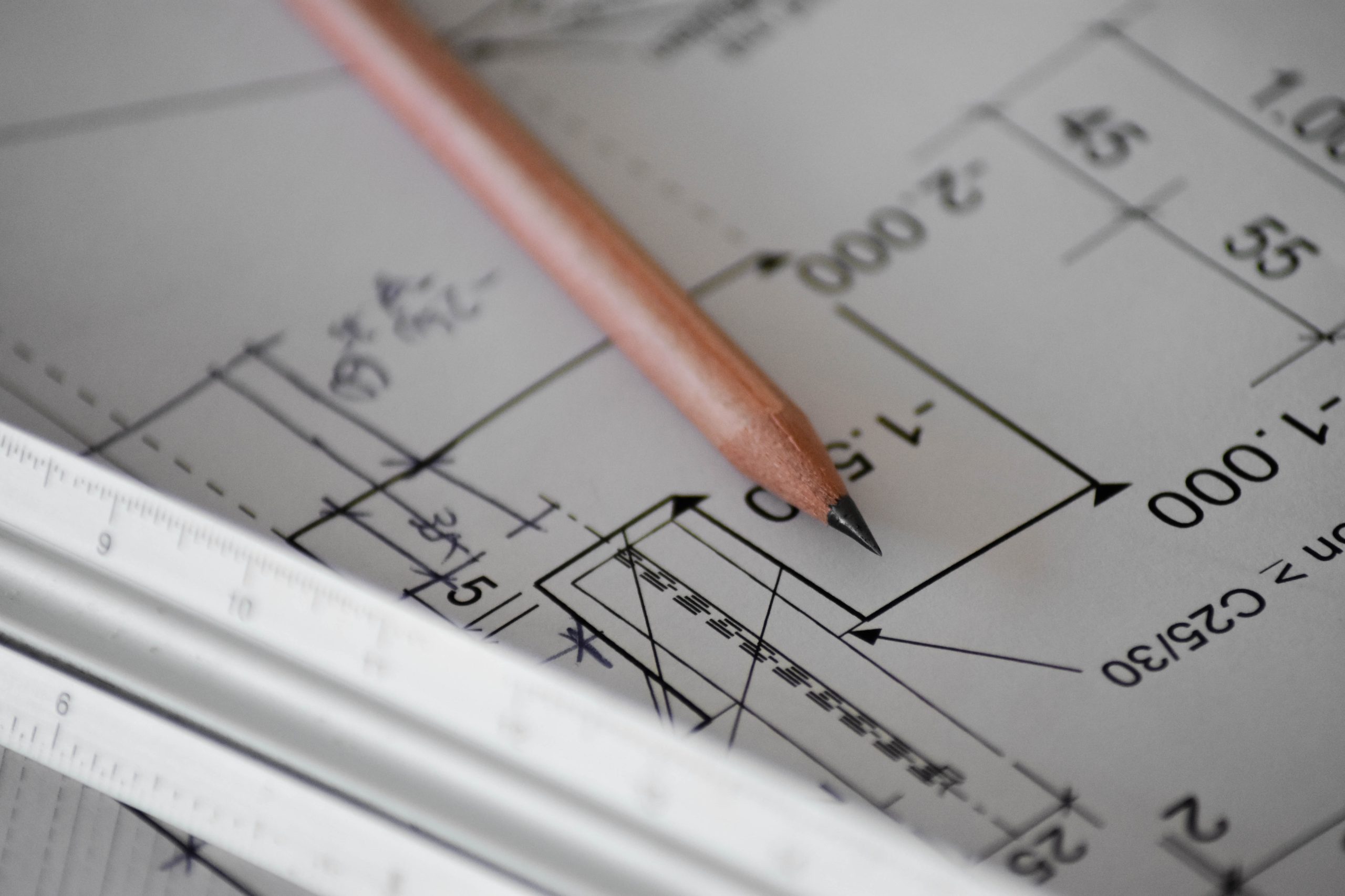 image of a floor plan for a building with a pencil sitting on top